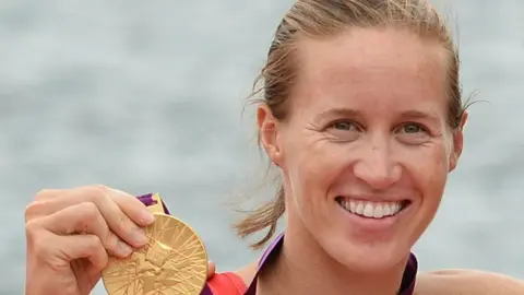 AFP/Getty Helen Glover and medal