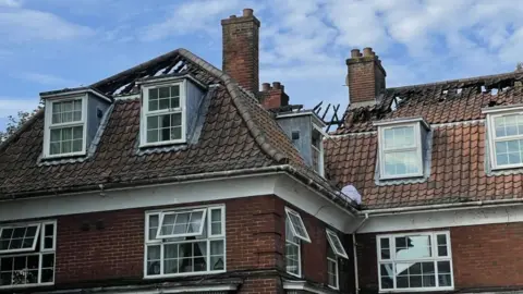 Robby West/BBC Fire damage to roofs