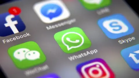 EPA File photograph showing apps including Whatsapp and Facebook