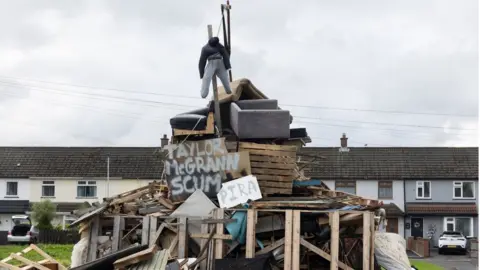 Other An effigy above a poster bearing the name of Taylor McGrann
