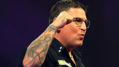 Gary Anderson in action at the Alexandra Palace