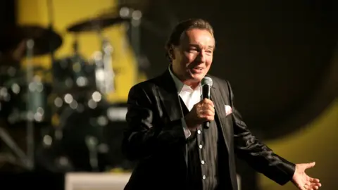 Reuters Czech legendary pop singer Karel Gott performs onstage during a concert in Prague, Czech Republic June 11, 2009