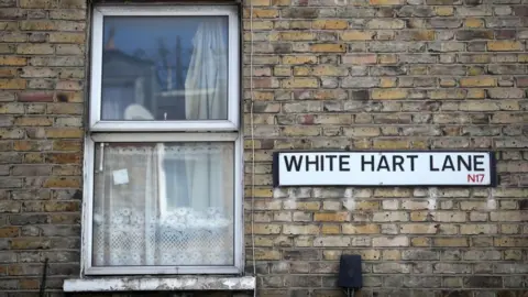 PA Media File image of a window next to a road sign for White Hart Lane