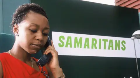 Samaritans A Samaritans councillor taking a phone call from someone needing emotional support