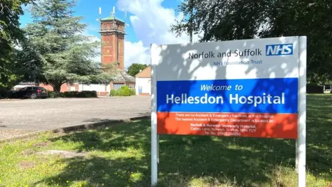 Martin Barber/BBC Sign outside the Norfolk and Suffolk NHS Trust headquarters