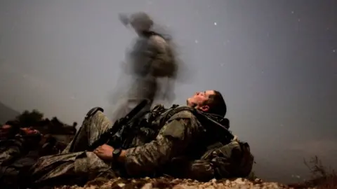 Reuters A US soldier rests during a night mission in Kunar province