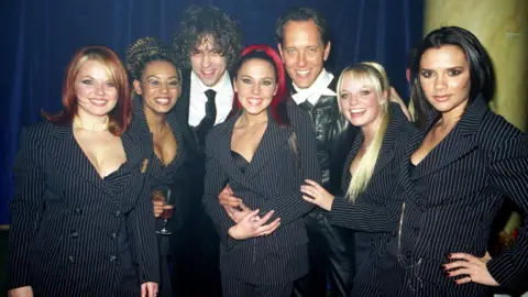 Alan Davidson/Shutterstock Richard E Grant with the Spice Girls and Bob Geldof