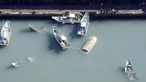 Reuters Upturned boats in Muroto, Kochi prefecture, Japan