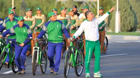 Getty Images President Berdymukhammedov leading a bike ride