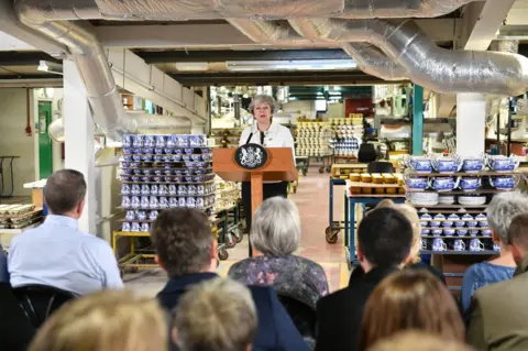 Getty Images Theresa May giving a speech