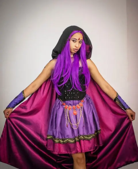 EPA Mia Kater, 17, dresses in her favorite Raven Cosplay outfit during the annual Comic Con Africa event in Johannesburg, South Africa, 23 September 2022. The coronavirus disease (COVID-19) pandemic had a positive effect on the African Gaming Market. The pandemic led to mandated stay-at-home orders, which resulted in the customers spending more time and money on various games and gaming consoles, which led to the growth of the commercial segment of the gaming market. Comic Con Africa is Africa's largest multi-genre pop-culture, Cosplay, gaming, and fan festival. The inaugural 2018 event welcomed over 42,000 visitors (ABC Audited), and 2019 saw over 70,000.