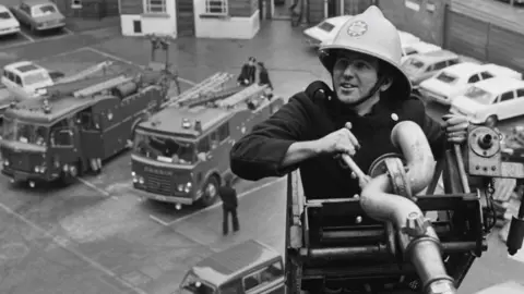 Evening Standard/Hulton Archive/Getty Images A stock image of a 1970s firefighter