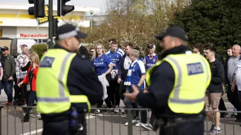 PA Media Police and Ipswich Town fans