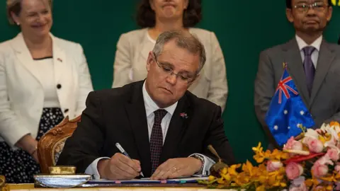 Getty Images Scott Morrison signs a deal with Cambodia