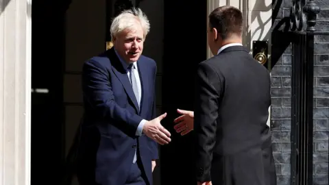 Reuters Boris Johnson shakes hands with Juri Ratas