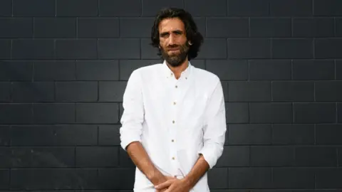 Getty Images Behrouz Boochani pictured during a photo shoot on November 19, 2019 in Christchurch, New Zealand.