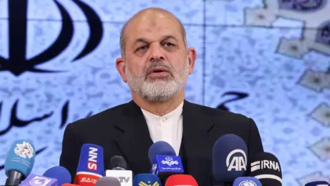 Getty Images Iranian Interior Minister Ahmad Vahidi speaks during a press conference in Tehran on March 4, 2024. Vahidi