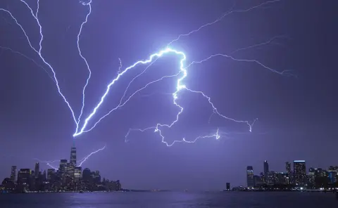 Gary Hershorn / Getty Images Lightning strikes One World Trade Center in New York City, US, on 1 April 2023