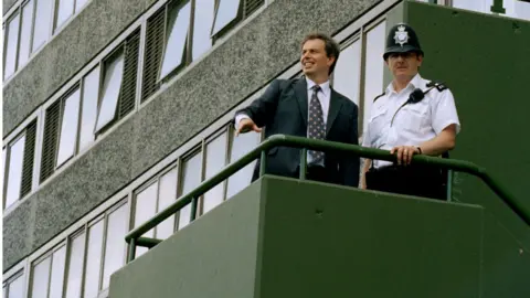Getty Images Tony Blair in a cherrypicker at Aylesbury Estate