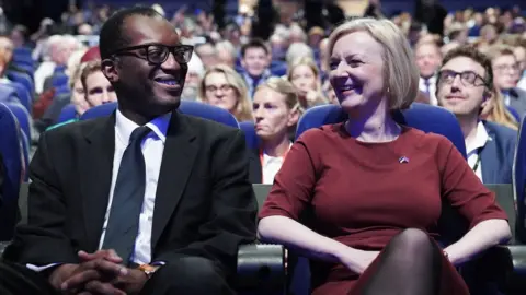 PA Media Kwasi Kwarteng and PM Liz Truss