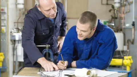 Getty Images Plumber in workplace training