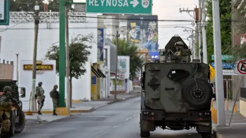 Getty Images Armoured vehicles sit on the streets of Matamoros, Tamaulipas, Mexico