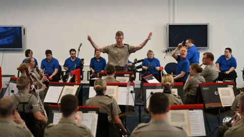 PA Media The Music Man Project has teamed up with the Royal Marines Band to record a Christmas single in tribute to the late MP Sir David Amess