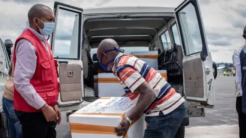 Getty Images Covax supplies being loaded at Goma airport in DR Congo