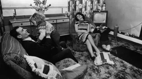 Albert McCabe/Getty Images Family in a new flat in the Gorbals area