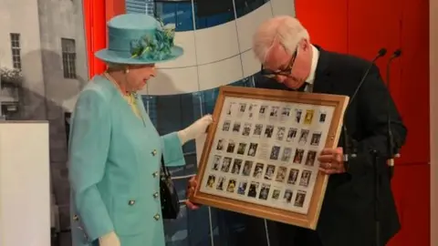 Lord Patten presenting a gift to the Queen