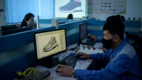 Getty Images A shoe designer in N Korea