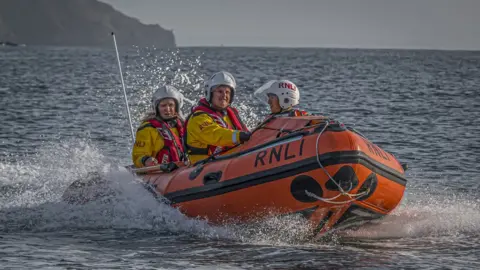 Austen Bannister RNLI D Class lifeboat with Amelia Luck at the helm