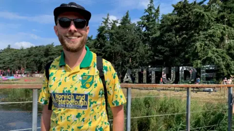 Joe Barker in a Norwich shirt at Latitude