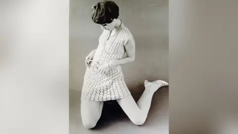 Mady Gerrard Mady in a knitted dress, modelling