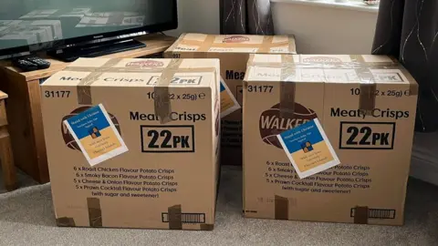 Lilita Kruz boxes of donations