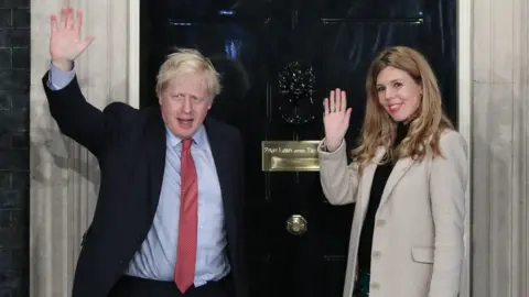 PA Media Boris Johnson and Carrie Symonds outside Downing Street