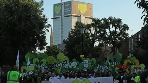 PA Media People on a silent walk to mark the two-year anniversary