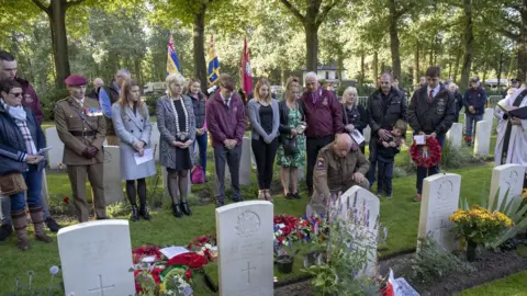 PA Media Family and friends of Dennis Collier attend an Interment of Ashes service at the CWGC Oosterbeek War Cemetery near Arnhem, Netherlands.