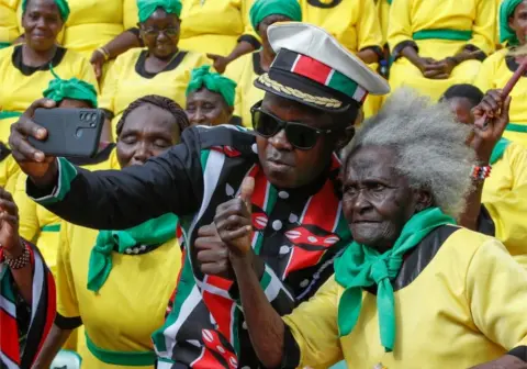 Reuters People dressed in symbolic colours pose for a photo.