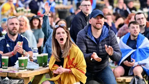 Getty Images Fans celebrating in Glasgow