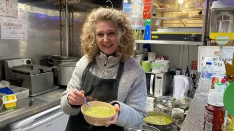 Martin Barber/BBC Alethea Stearman runs The Mushy Pea stall