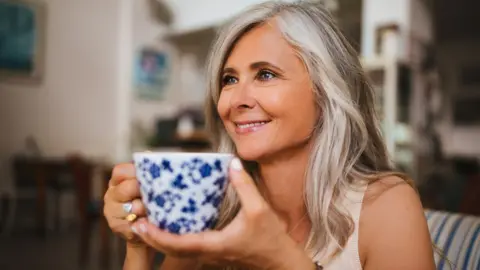 Getty Images Woman drinking tea