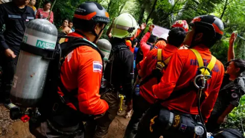 AFP/Getty Thai rescuers prepare to try to save the trapped children and coach June 2018