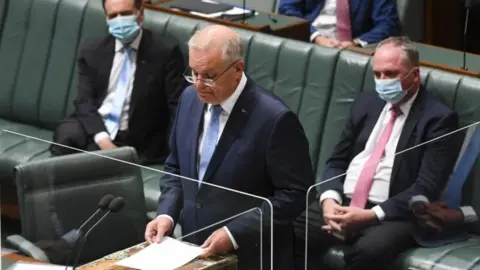 EPA Scott Morrison reads the apology in parliament
