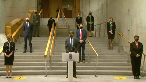 MSPs gather to mark the one-year anniversary of the country going into the first lockdown