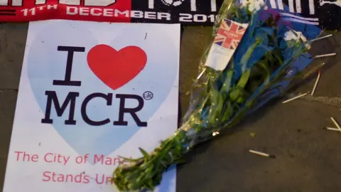Getty Images Flowers laid for Manchester attack victims