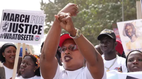 AFP A relative of one of the victims of the regime of Yahya Jammeh gestures during a demonstration asking for the former Gambian president to be brought to justice - Banjul, 25 January 2020