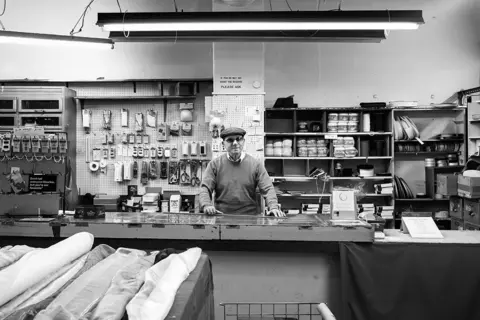 Jim Grover Maurice Dorfman in his shop