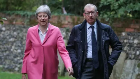 PA Theresa May and her husband Philip arrive for a church service near to her Maidenhead constituency. Sunday October 21, 2018.