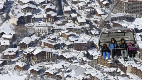 Getty Images Skiers use skis lifts up the slopes at the ski resort in Val-d'Isere, in the French Alps